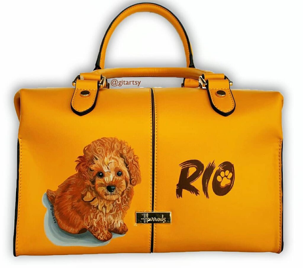 Toy poodle dog custom painted pet portrait on a yellow harrods handbag and name of dog RIO